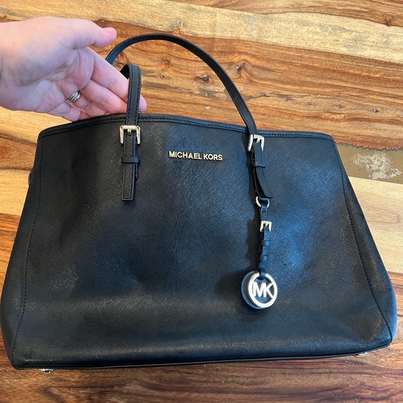 Michael Kors Collection Handbags - Black hard leather Michael kors handbag. 14 inches wide by 10 inches tall.